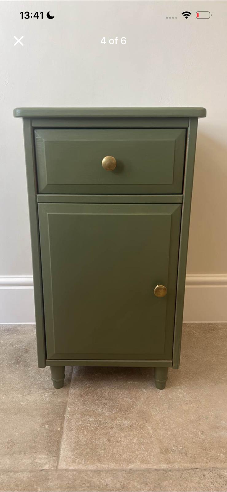 Photo of olive green bedside tables with rounded corners, one drawer above a cupboard.